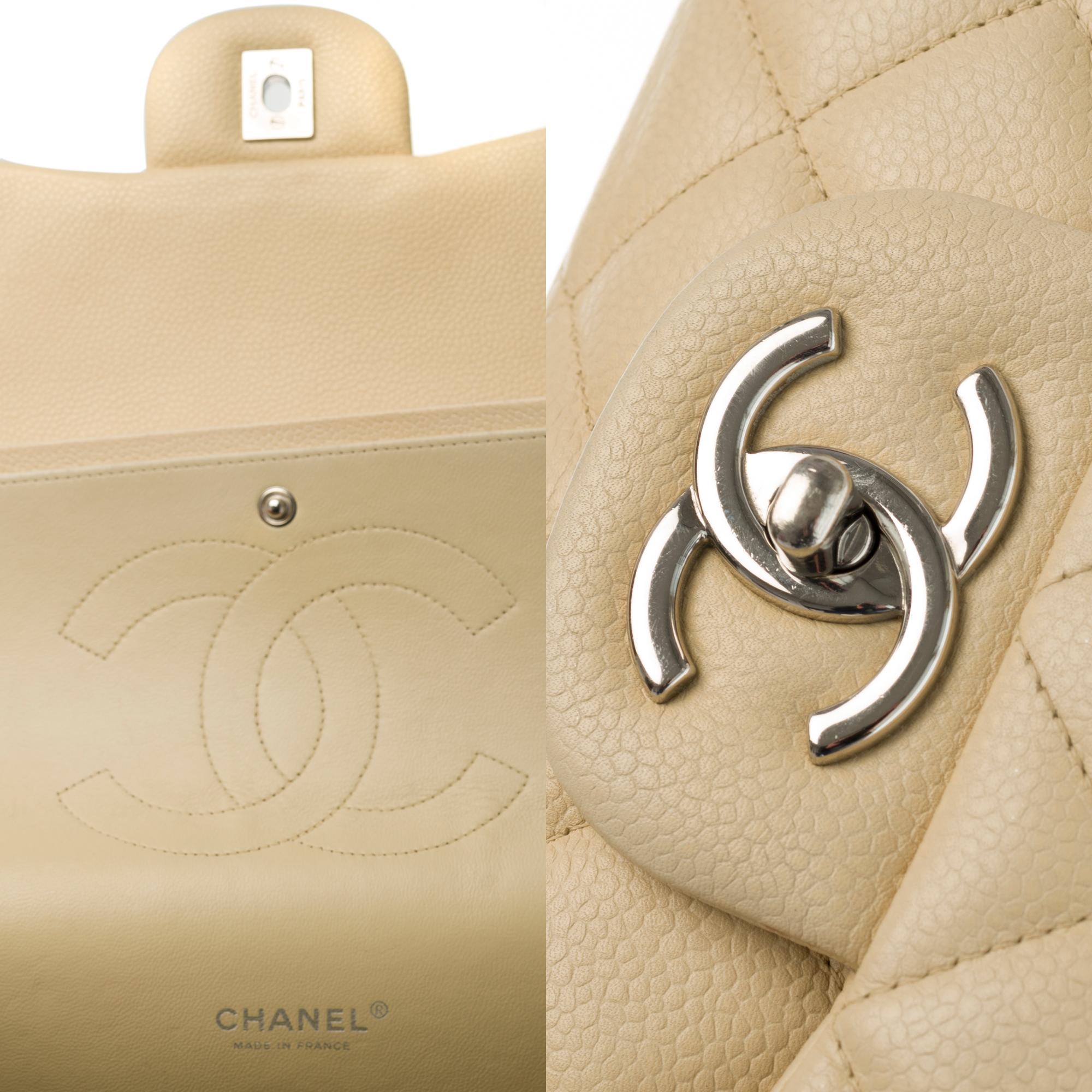 Women's Chanel Timeless Maxi Jumbo shoulder bag in beige quilted caviar leather, SHW