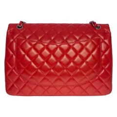 Chanel Timeless Maxi Jumbo single flap handbag in black quilted patent leather