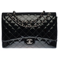 Chanel Timeless Maxi Jumbo single flap handbag in black quilted patent leather
