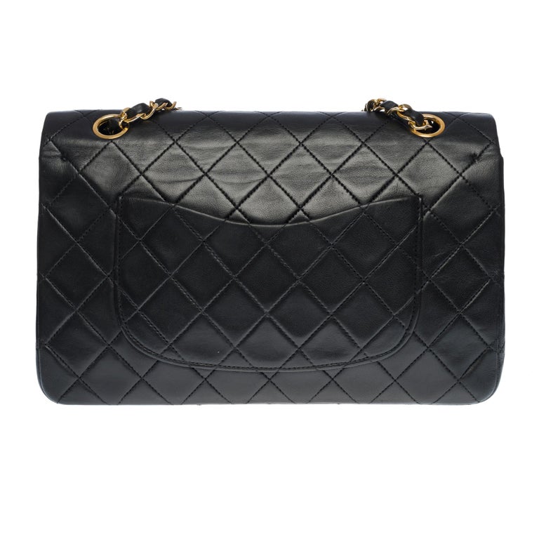 Chanel Timeless Medium double flap shoulder bag in black quilted ...