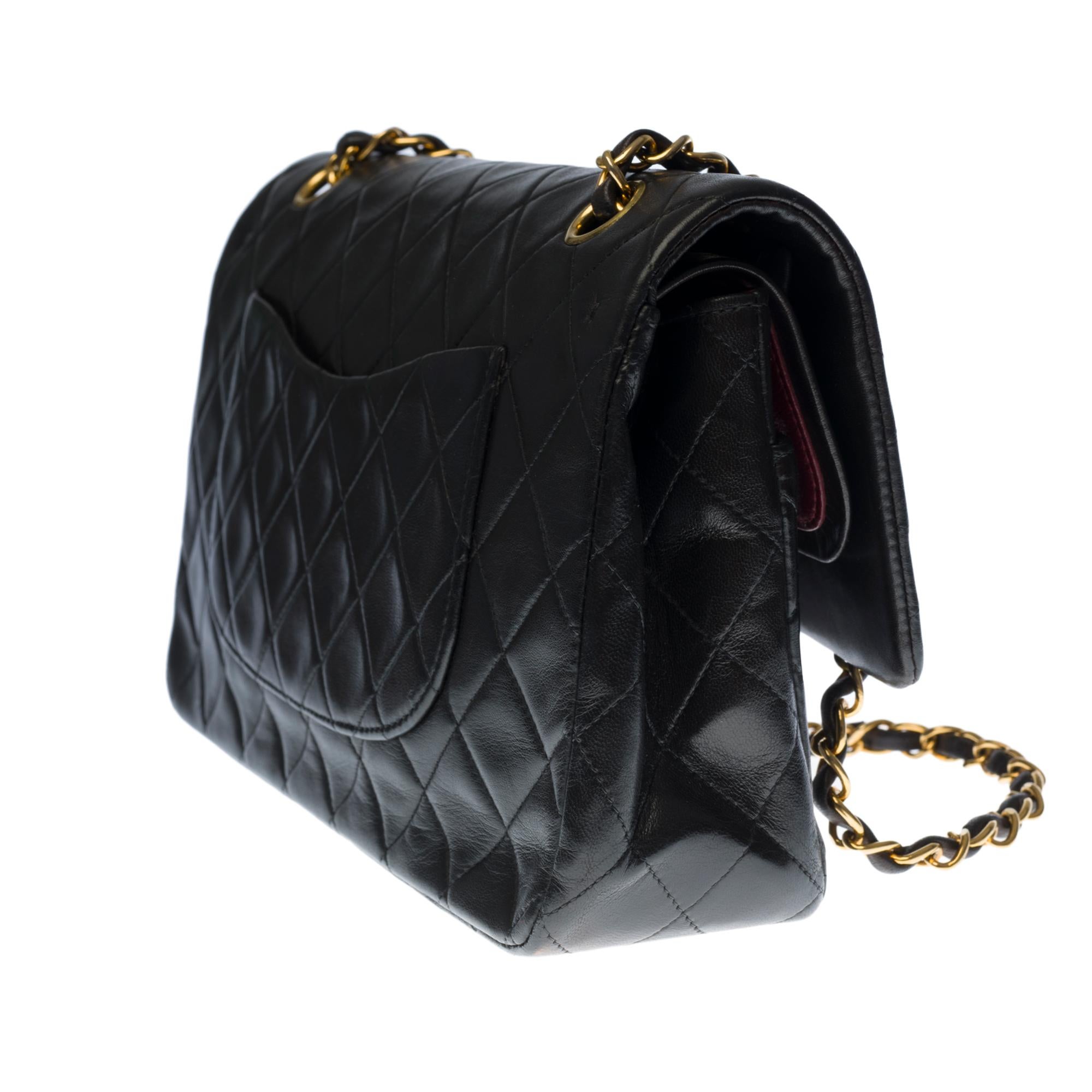 Chanel Timeless Medium double flap shoulder bag in black quilted lambskin, GHW In Good Condition In Paris, IDF
