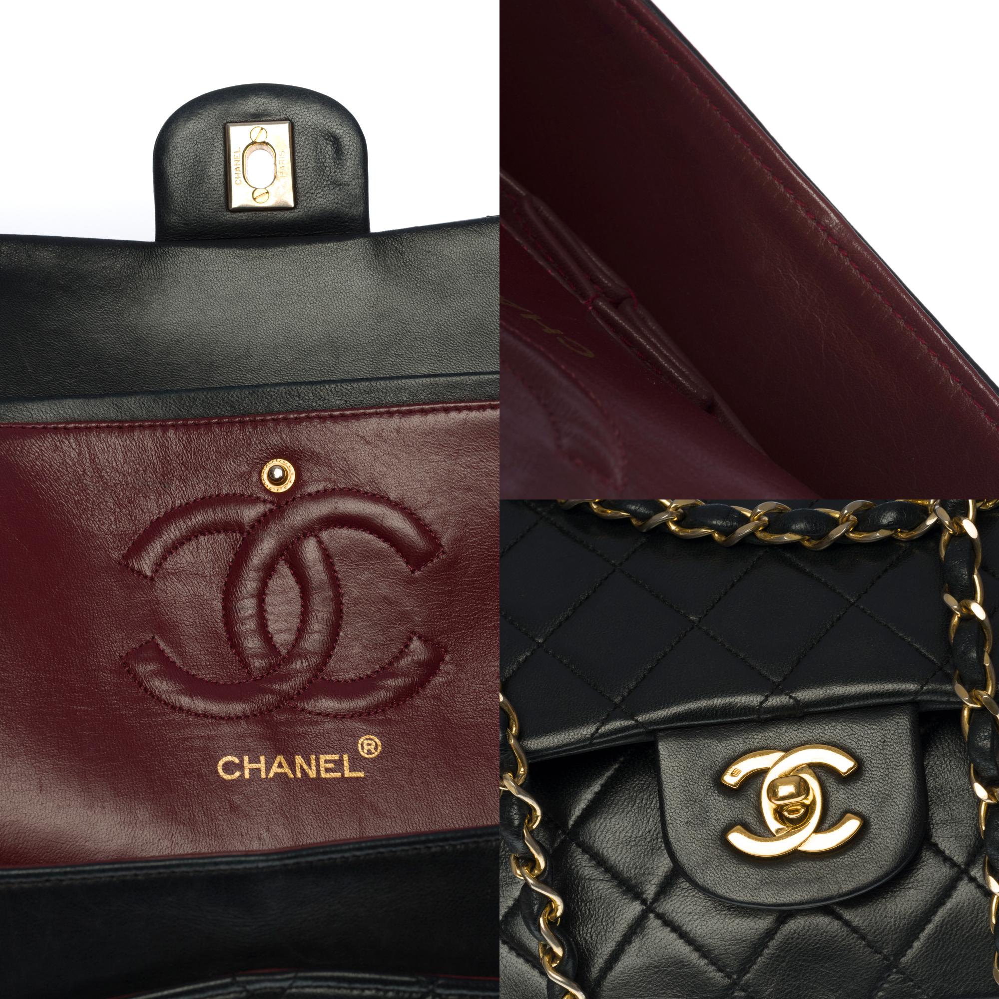 Chanel Timeless medium double flap shoulder bag in black quilted lambskin, GHW For Sale 1