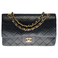 Chanel Timeless Medium double flap Shoulder bag in black quilted leather, GHW