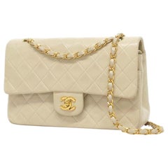 Chanel Timeless medium handbag in Ivory quilted leather and gold hardware