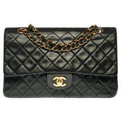 Chanel Timeless Medium Shoulder bag in black quilted lambskin and gold hardware