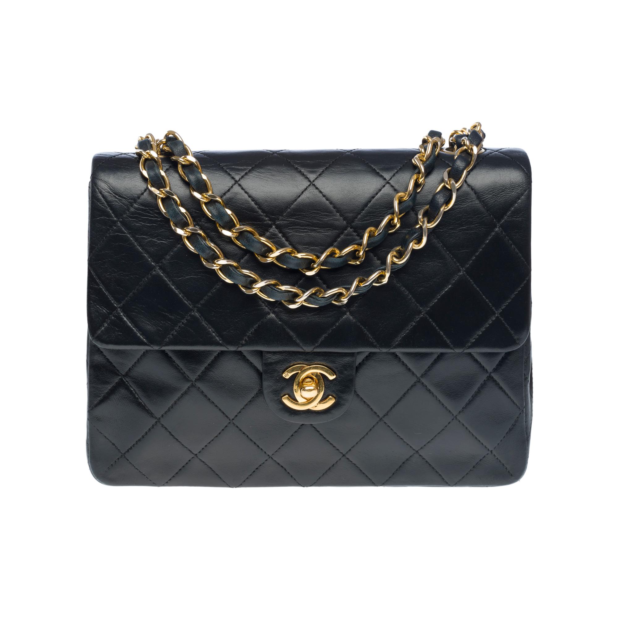 Beautiful​ ​Chanel​ ​Mini​ ​Timeless​ ​shoulder​ ​flap​ ​bag​ ​in​ ​black​ ​quilted​ ​lambskin​ ​leather,​ ​golden​ ​metal​ ​strap​ ​interlaced​ ​with​ ​black​ ​leather​ ​allowing​ ​a​ ​shoulder​ ​or​ ​crossbody​ ​carry

Closure​ ​by​ ​flap​ ​and​