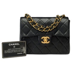 Chanel Timeless Mini shoulder Flap bag in black quilted lambskin leather , GHW