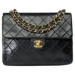 Chanel Timeless Mini shoulder Flap bag in black quilted lambskin leather , GHW