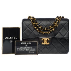 Used Chanel Timeless Mini Square shoulder Flap bag in black quilted lambskin, GHW