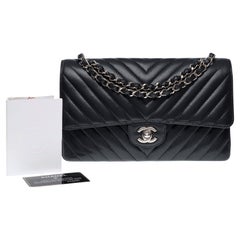 Chanel Timeless shoulder bag in black chevrons quilted caviar leather , PHW