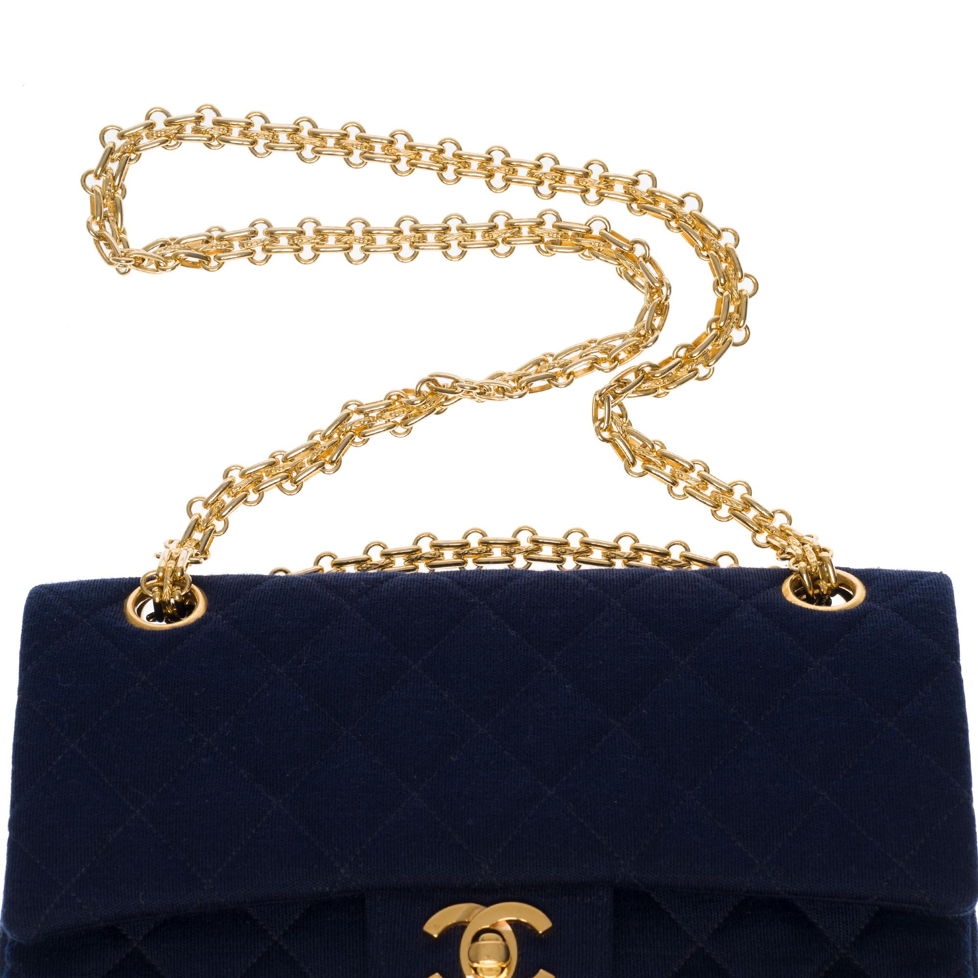Women's Chanel Timeless shoulder bag in navy blue quilted jersey with gold hardware