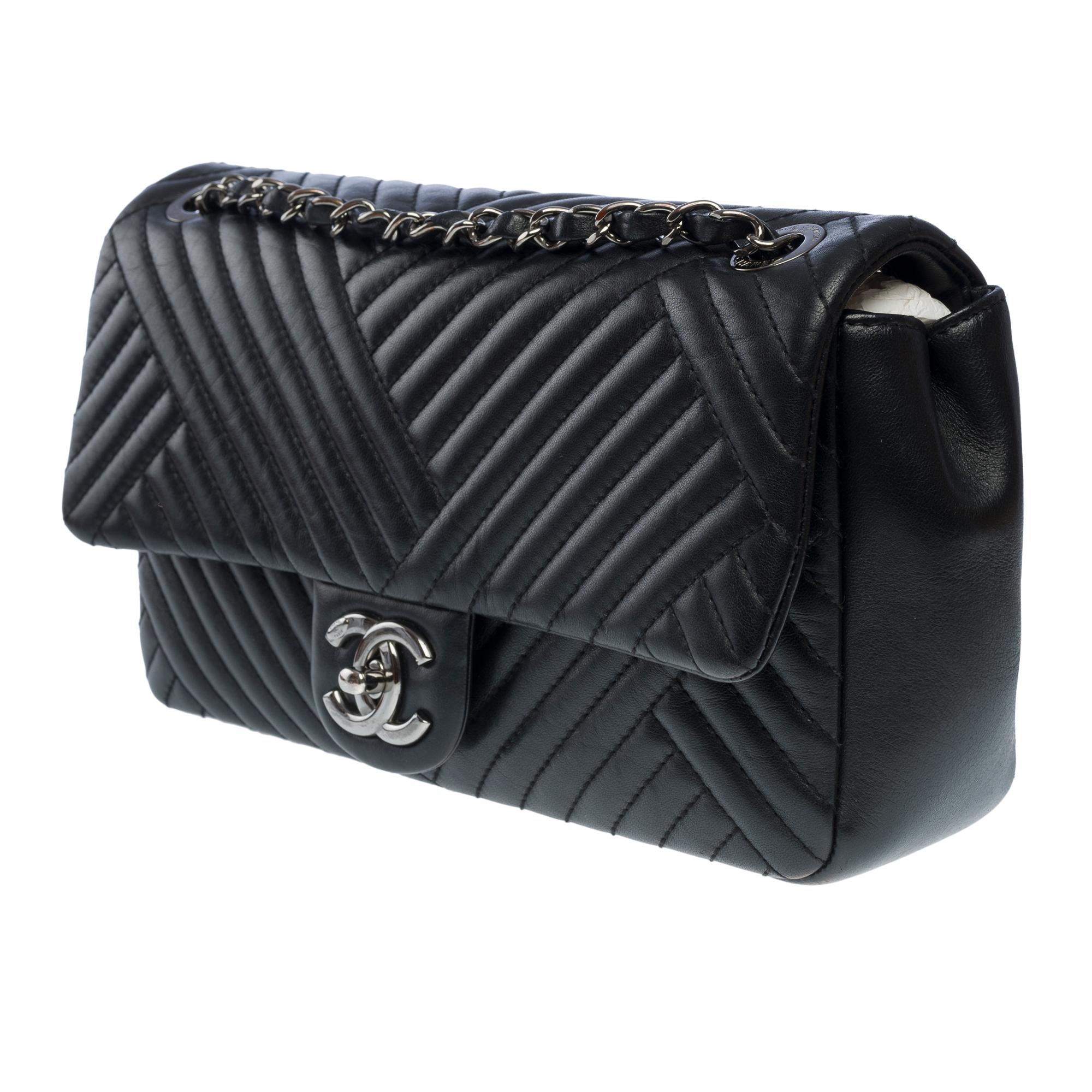 Women's Chanel Timeless shoulder flap bag in black asymmetrical lambskin leather, RHW