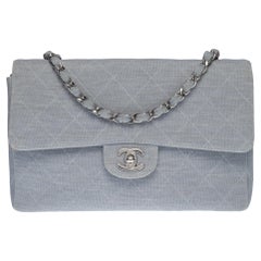 Vintage Chanel Timeless shoulder flap bag in blue quilted jersey with silver hardware