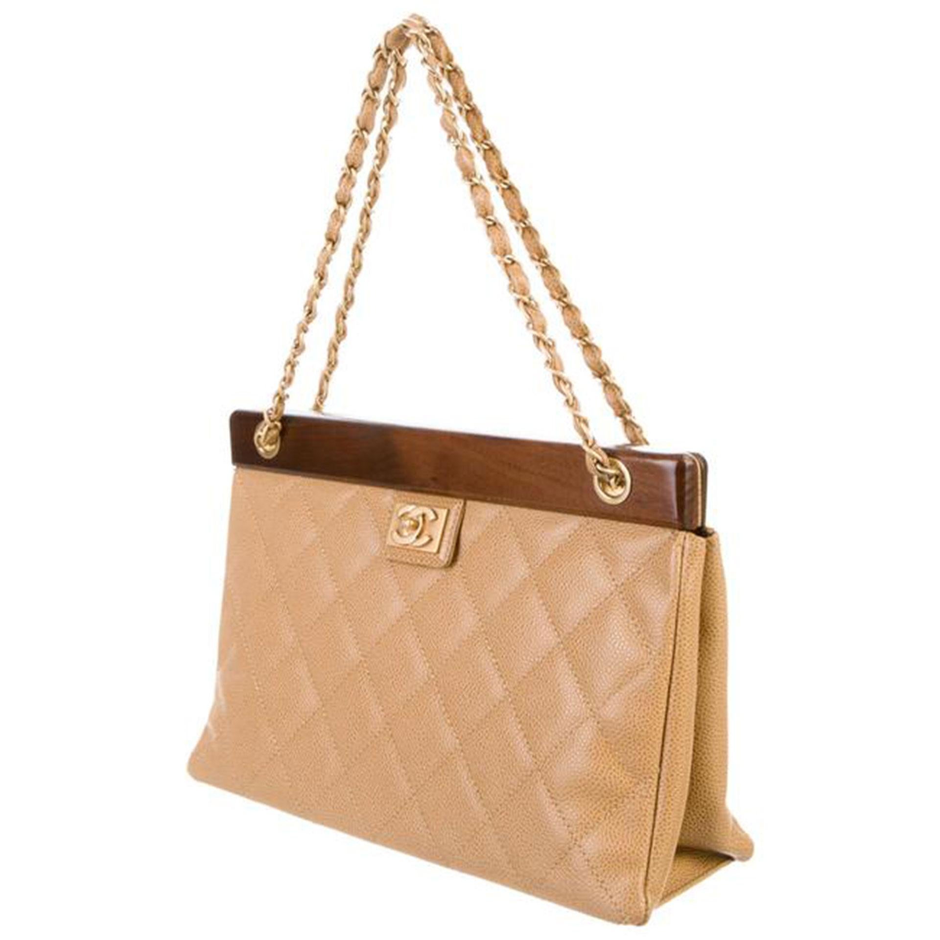 Chanel Vintage Classic Beige Caviar Wood Medium Tote Bag

Gold hardware
CC logo at front
Beige quilted Caviar leather
Classic interwoven chain straps
concealed magnetic closure at top frame
Leather lined beige interior
Main interior zippered