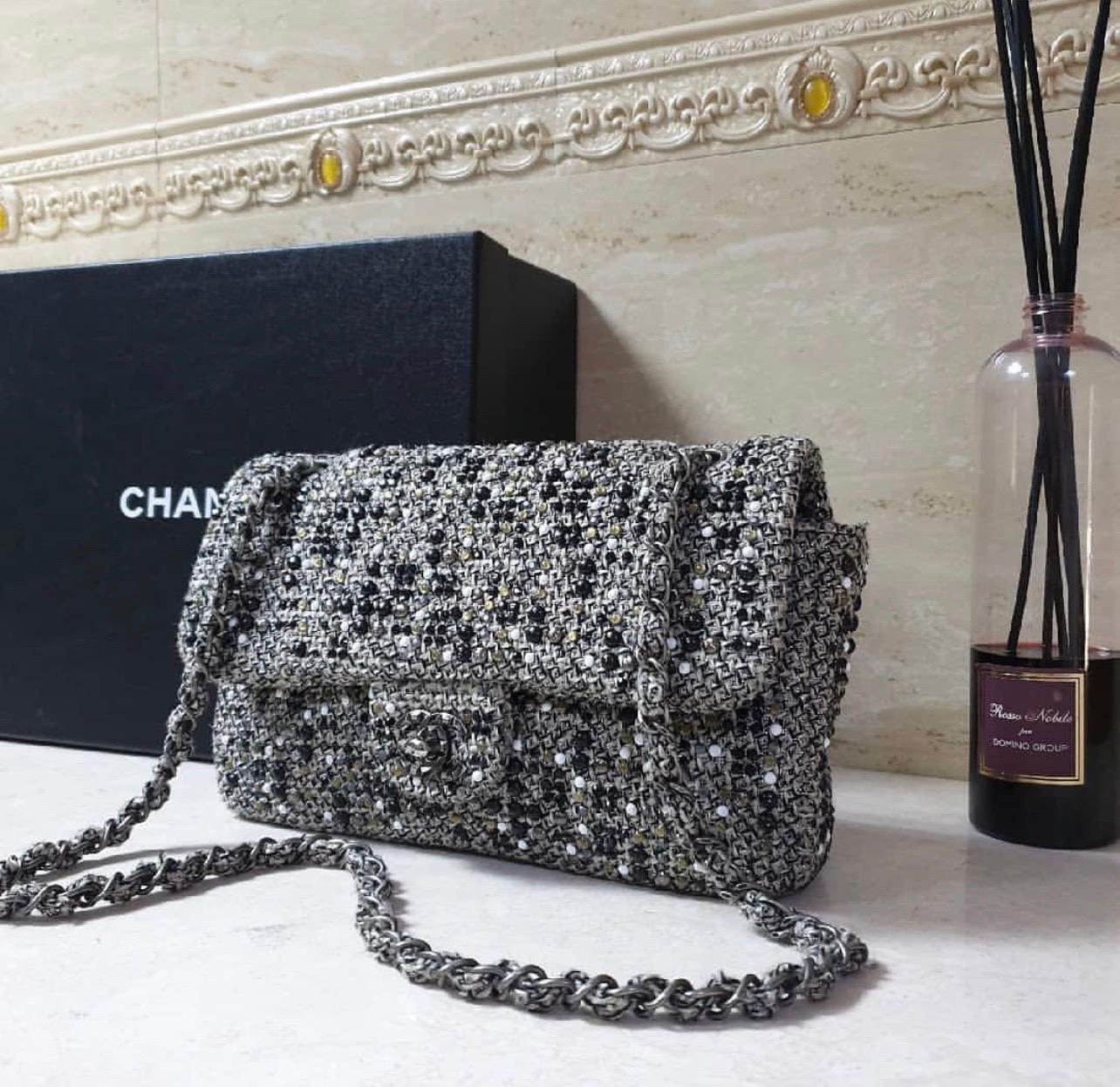 CHANEL Timeless Tweed Rhinestone Flap Bag Handbag

The original CHANEL Timeless Tweed rhinestone flap bag handbag is an elaborately processed handbag in the typical timeless style of Chanel. It is made of high-quality woven tweed fabric and features