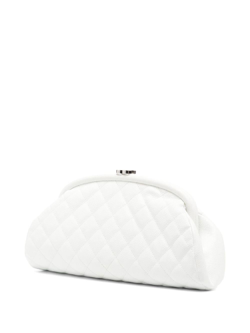 This classic Chanel white Clutch is the perfect addition to any evening look. Crafted in France in 2006 from high-grade leather, the iconic quilted design is among Gabrielle Chanel's most beloved. Featuring a push-lock closure, silver-tone hardware,