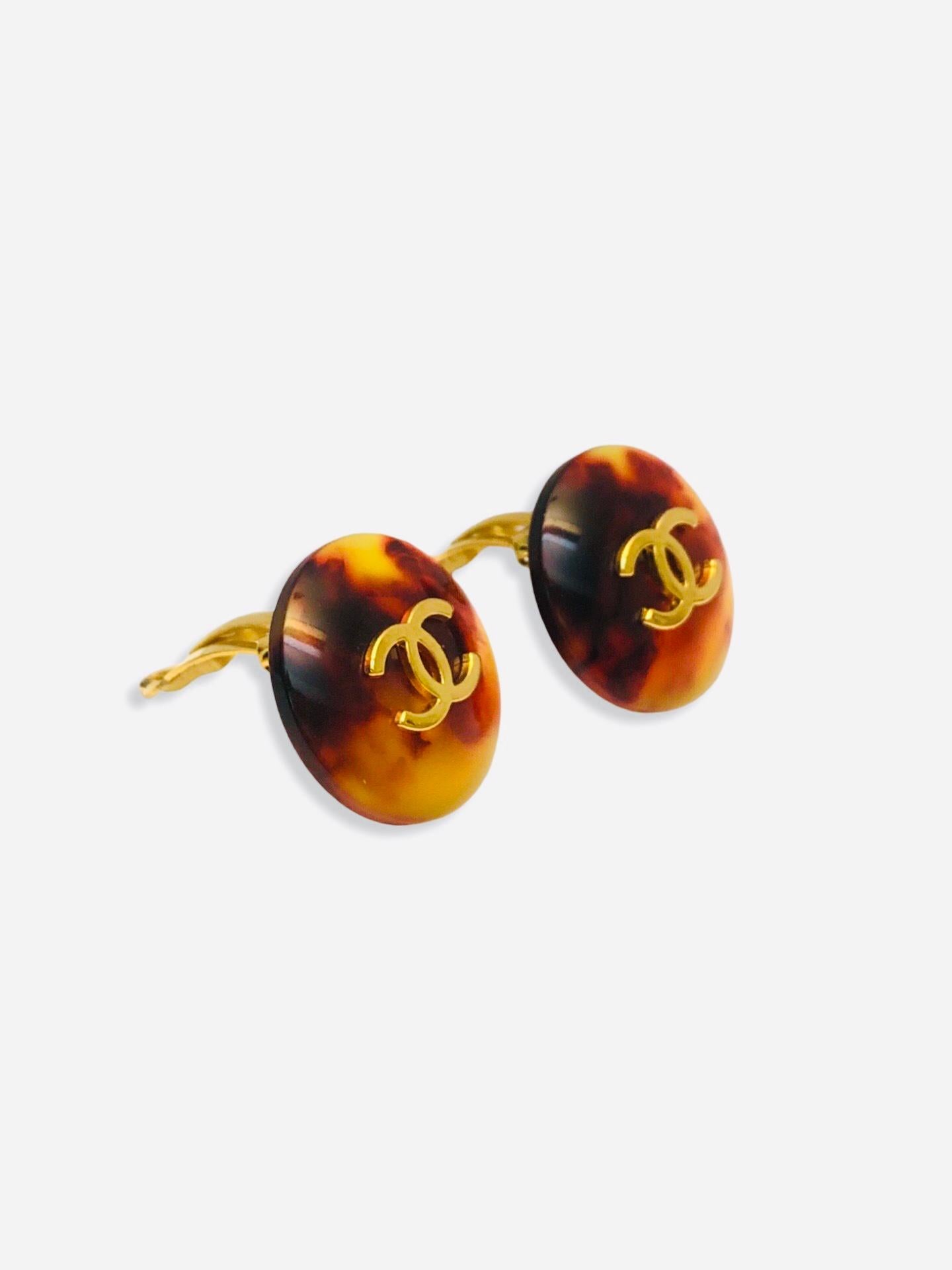 - Rare Chanel resin clip on earrings from 1997 collection. 

- Featuring CC gold hardware. 

