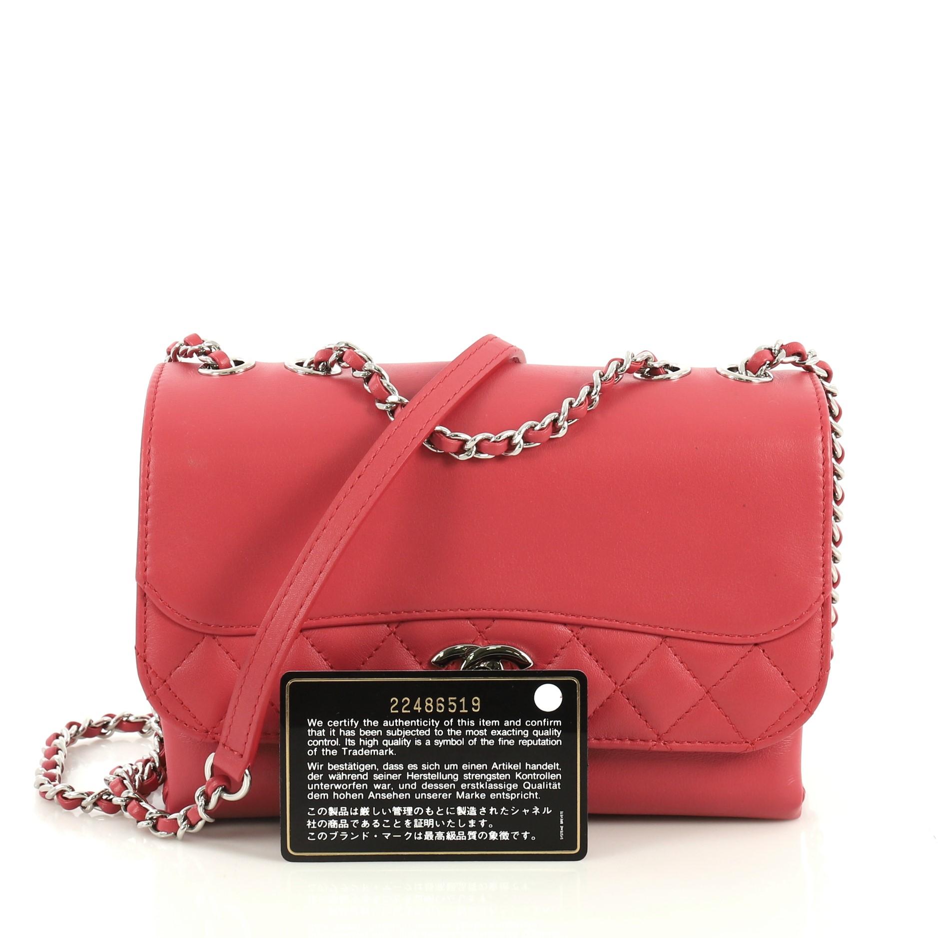 This Chanel Tramezzo Flap Bag Calfskin Small, crafted in red calfskin leather, features woven in leather chain link straps with leather pads, exterior back slip pocket and silver-tone hardware. Its CC turn-lock closure opens to a red fabric interior