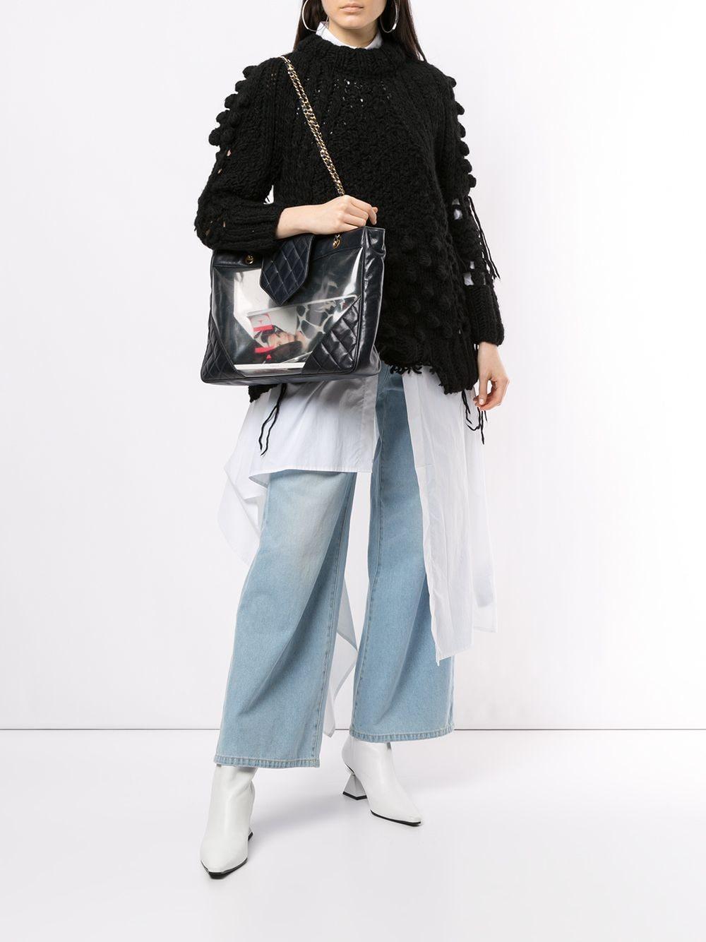 Chanel Transparent Clear Vintage PVC See Through XL Tote Shopping Tote

Year: 1990's {VINTAGE 25+ Years}

Gold hardware
Dark navy blue diamond quilted calfskin 
Clear sides made of transparent PVC
Classic interwoven chain and leather straps
Magnetic
