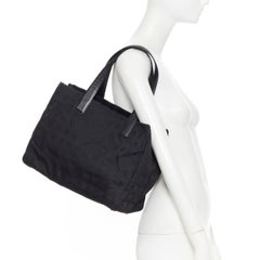 CHANEL Travel Ligne black checked CC jacquard fabric leather handle tote bag