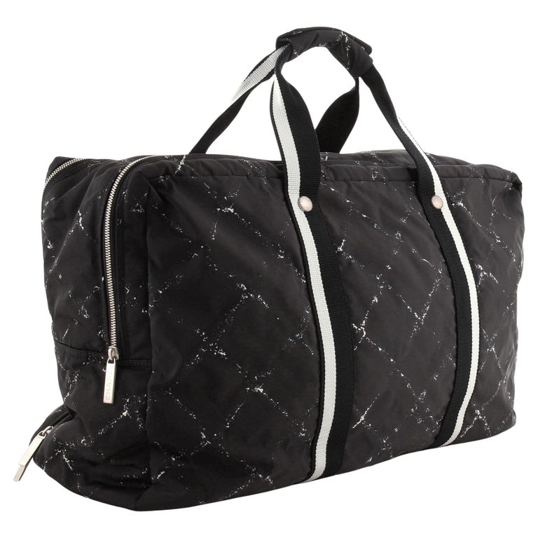 Chanel Travel Line Large Duffle Bag features black printed nylon For Sale  at 1stDibs