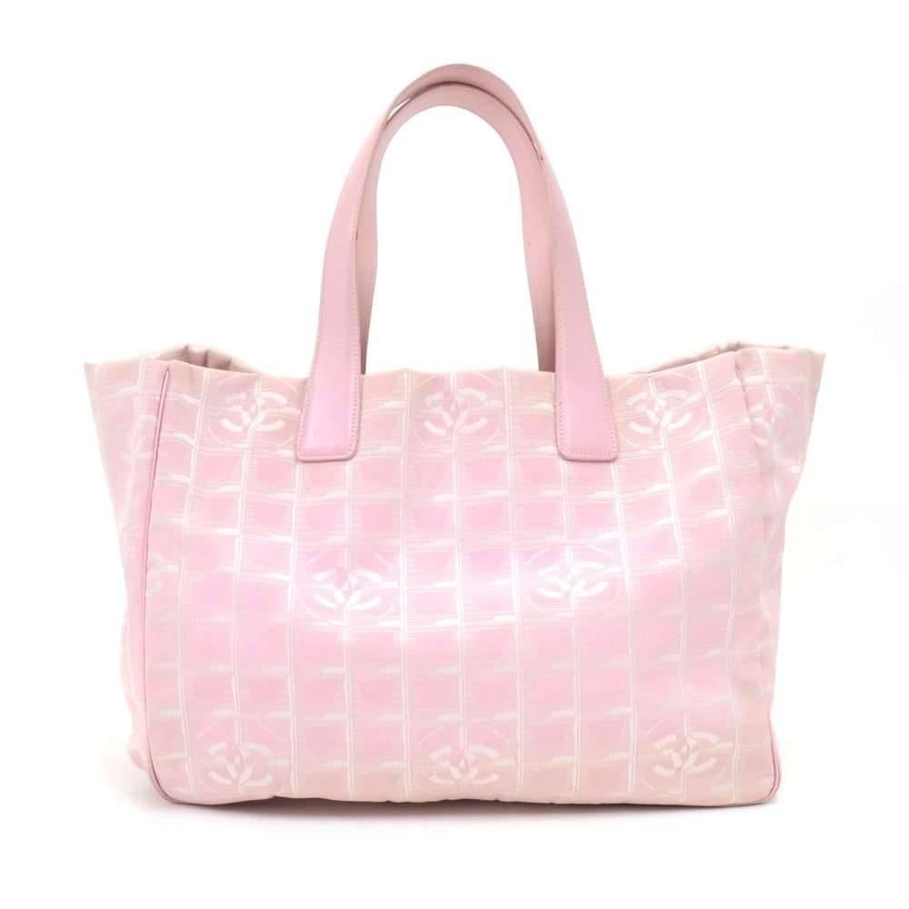 Chanel Travel Line Tote Bag in pink Jacquard nylon. Inside has white washable lining with 2 zipper pockets. This stunning bag offers great capacity and easy access. SKU: CG661

Made in: Italy
Serial Number: 8074157
Size: 13 x 5.9 x 10.2 inches or 33