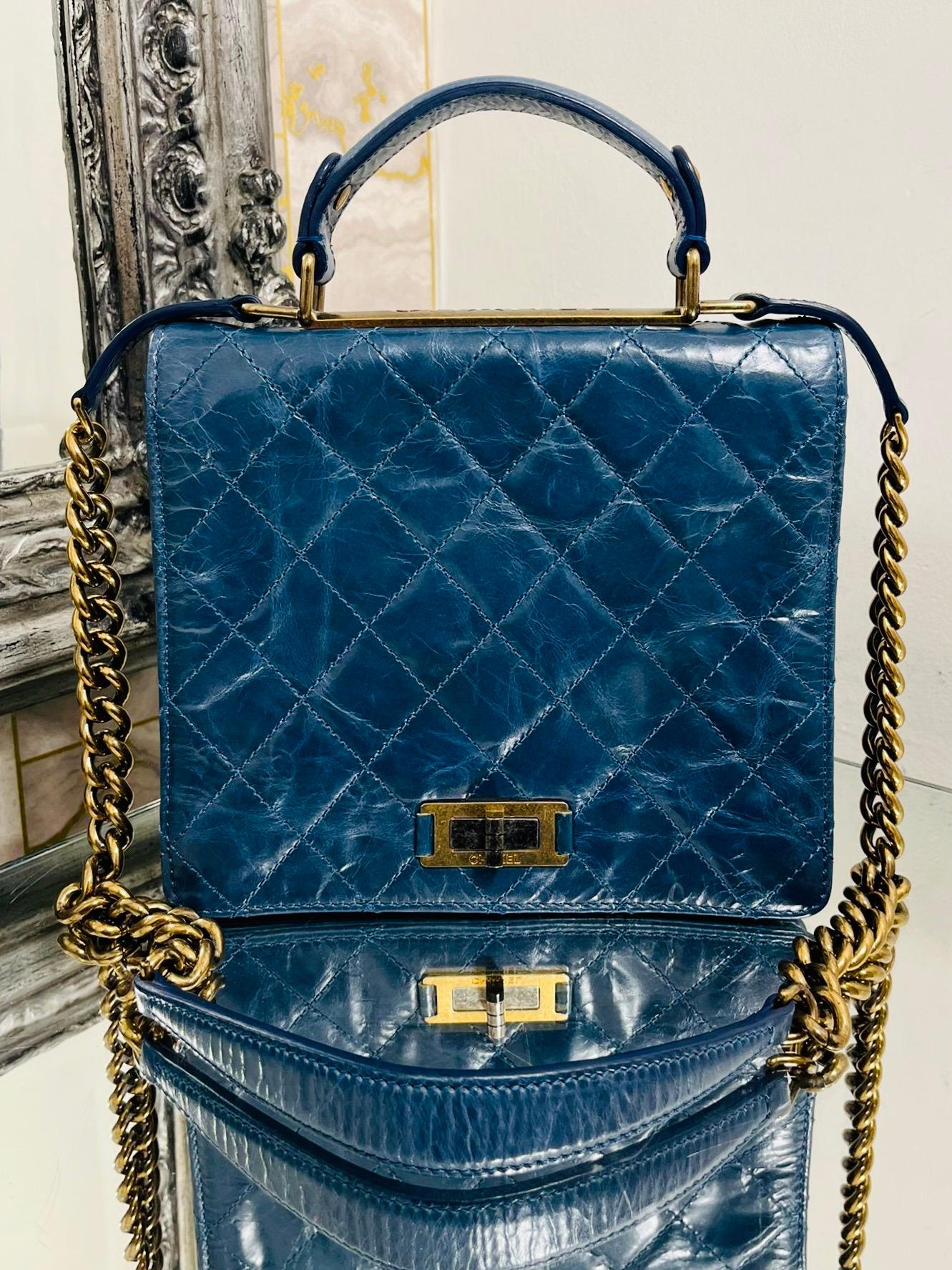 Chanel Trendy Aged Leather Bag

From 2011 collection, in blue aged leather with gold antique hardware.

Flap with re-issue iconic closure. On the top of the bag is a gold plate with 

large 'CHANEL' engraved lettering. Top leather carry handle and