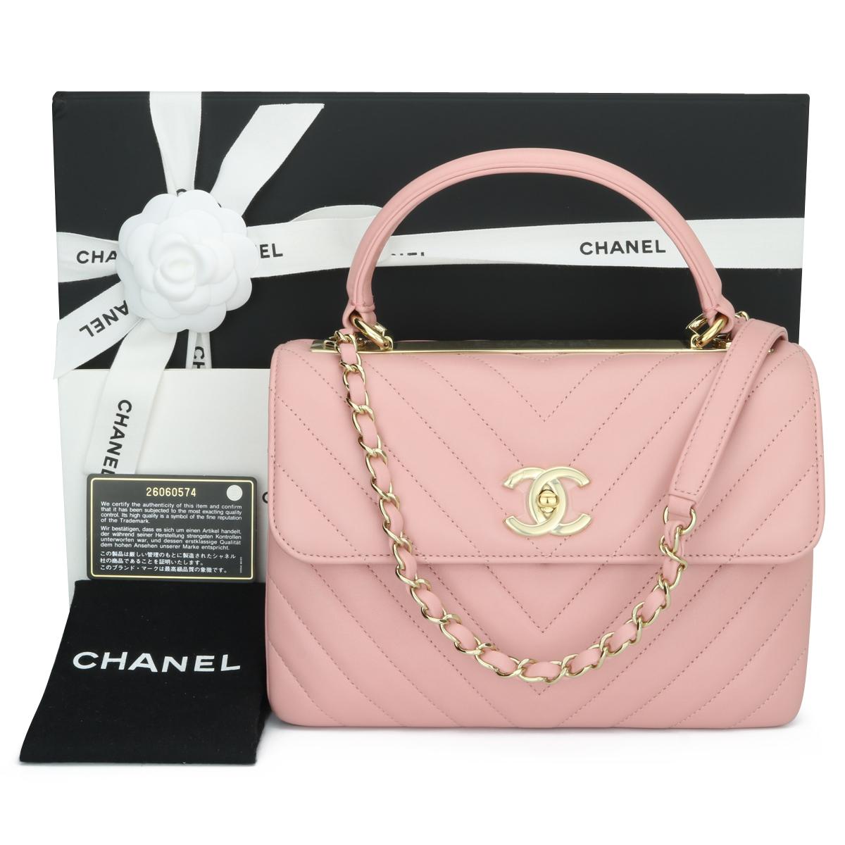 Authentic CHANEL Trendy CC Top Handle Bag Small Chevron Light Pink Lambskin with Light Gold Hardware 2018.

This stunning bag is in pristine-as new condition, the bag still holds its original shape, and the hardware is still very shiny. The leather