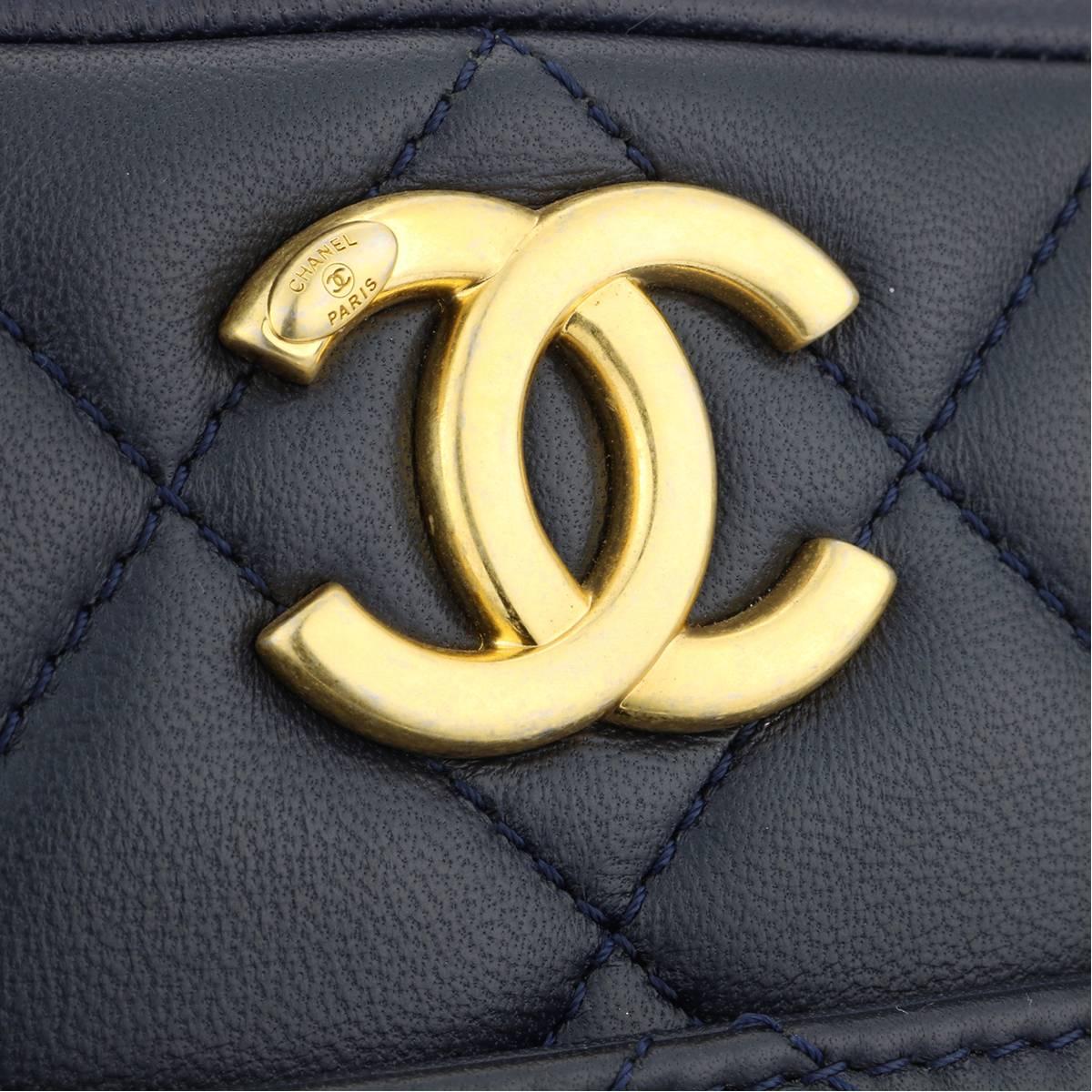 Authentic CHANEL Trendy CC Bowling Small Navy Lambskin with Gold Hardware 2016.

This stunning bag is in a mint condition, the bag still holds its original shape, and the hardware is still very shiny.

Exterior Condition: Mint condition, corners