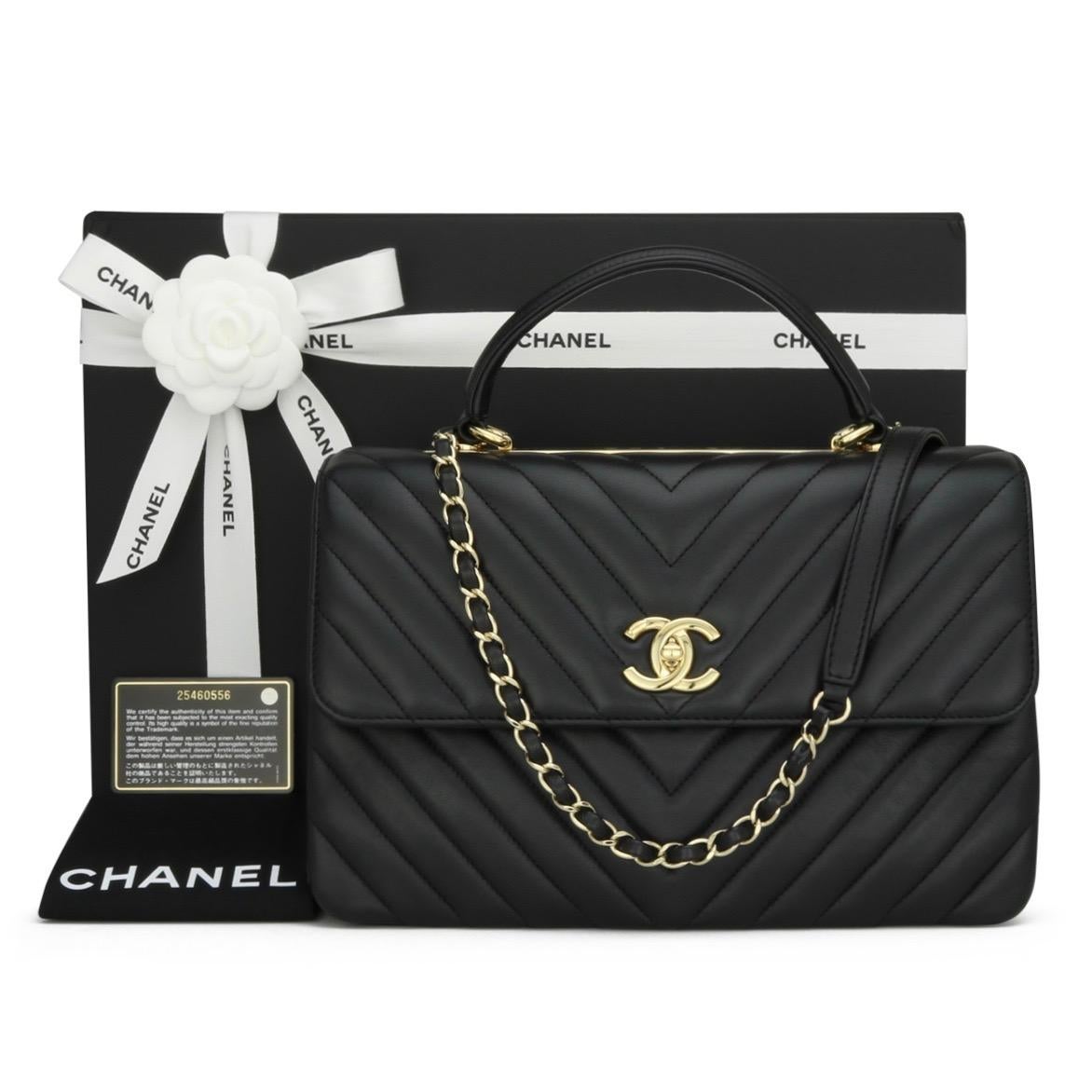 CHANEL Trendy CC Chevron Top Handle Bag Medium Black Lambskin with Light Gold-Tone Hardware 2018 – 18P.

This stunning bag is in excellent condition. It still holds its original shape, and the hardware is very shiny. The leather smells fresh, as if