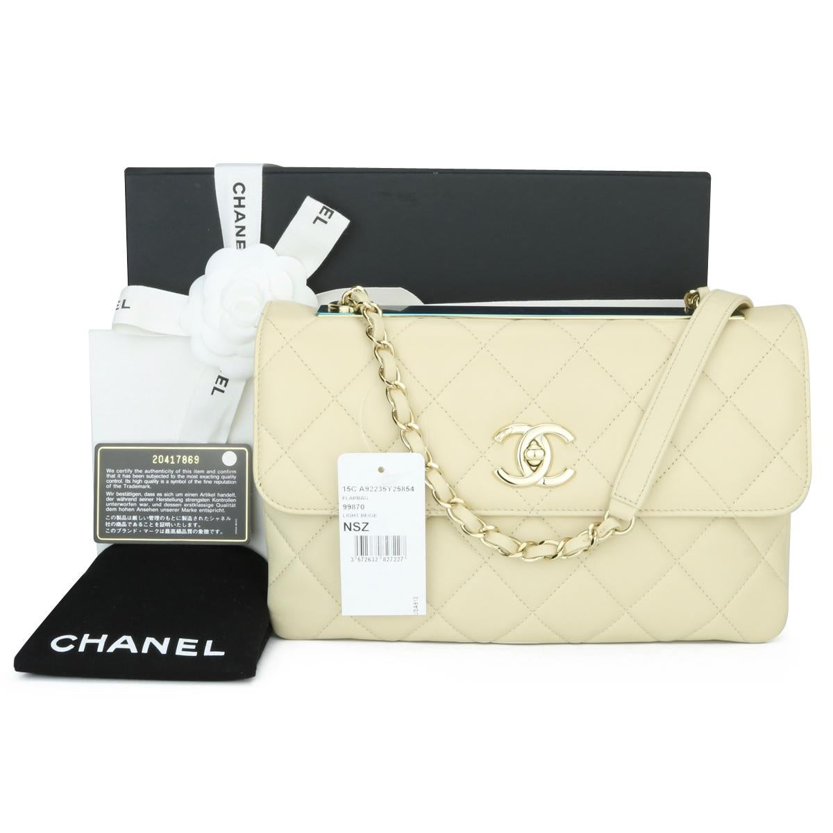 CHANEL Trendy CC Flap Shoulder Bag Light Beige Quilted Lambskin with Light Gold Hardware 2015.

This stunning bag is in pristine- never worn condition, the bag still holds its original shape, and the hardware is still very shiny. The leather smells