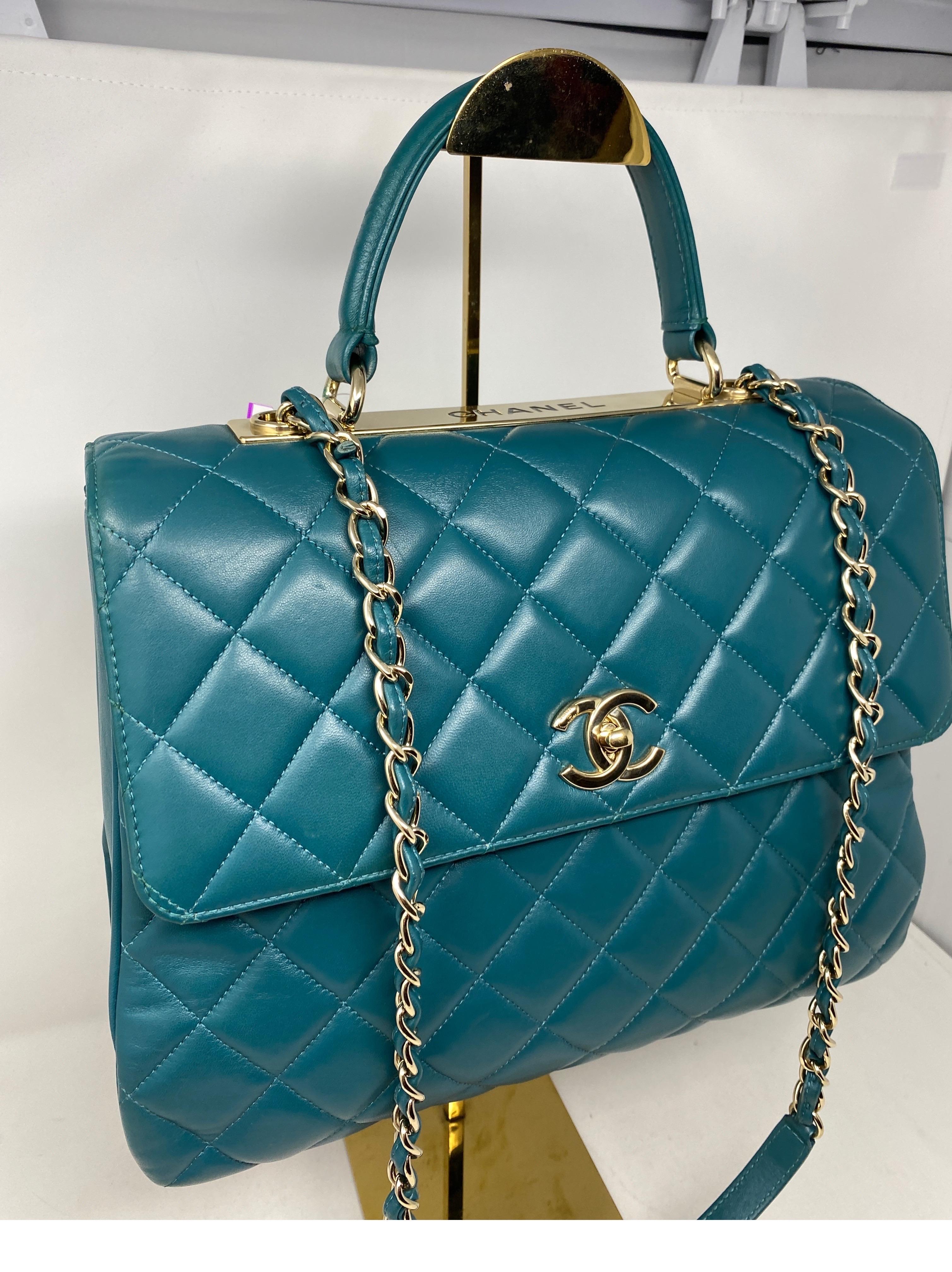 Chanel Trendy Teal Large Bag. Bright teal aqua color leather bag. Gold trendy plaque with gold hardware. Excellent like new condition. Clean maroon color leather interior. Authenticity card included. Guaranteed authentic. 