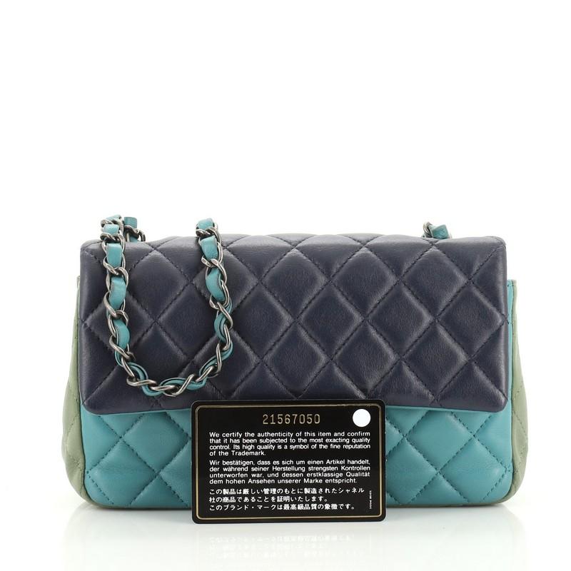 This authentic Chanel Tricolor Classic Single Flap Bag Quilted Lambskin Mini, crafted from multicolor blue quilted lambskin leather, this eye-catching flap bag features woven-in leather chain link strap, exterior back pocket, CC turn-lock closure,