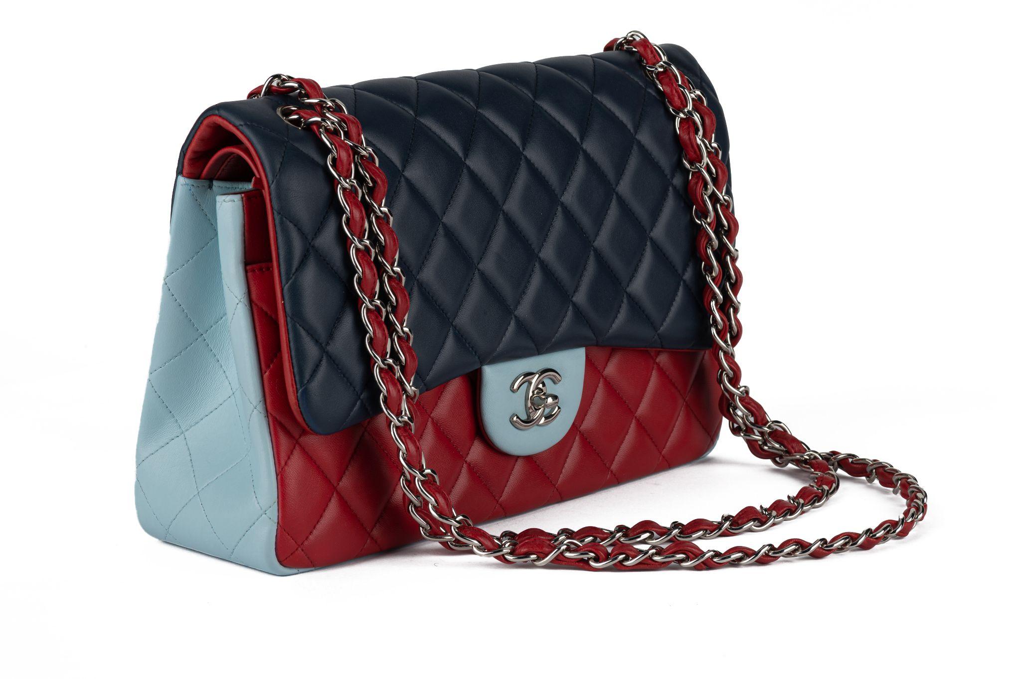 Chanel excellent condition tricolor lambskin jumbo double flap, blue, red, celeste and palladium hardware. Shoulder strap 13.5”. Collection 22. Original dust cover and hologram. Store retail $11,000.