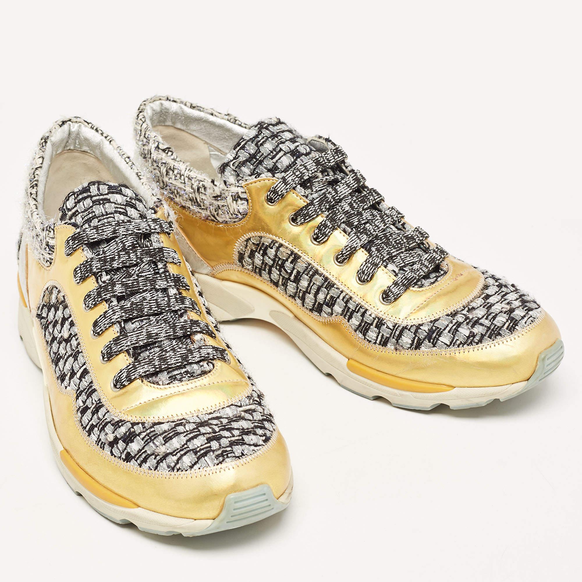 Indulge in luxe comfort with these designer sneakers from the house of Chanel. Featuring lace-ups and logo details, they are crafted from tweed & leather and finished with rubber soles. The perfect addition to a multitude of casual outfits and