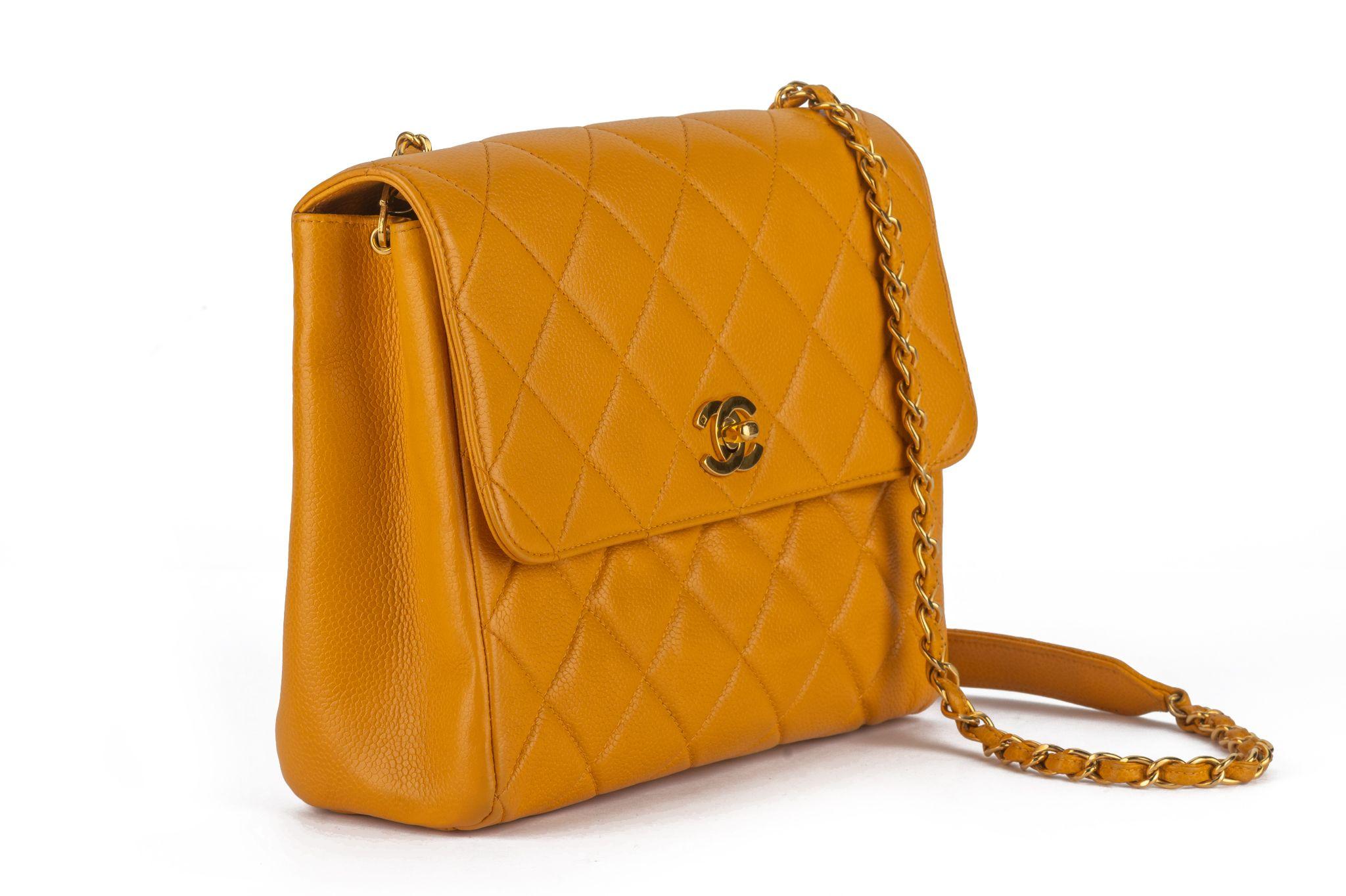 Chanel Turn-Lock Chain Bag Mustard with a CC closure and leather intertwined shoulder strap/cross-body strap. Interior zipper pocket and exterior pocket on back. Comes with an authenticity card and original box.
First two numbers 39.