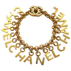 CHANEL Turnlock CC Gold Charm Bracelet