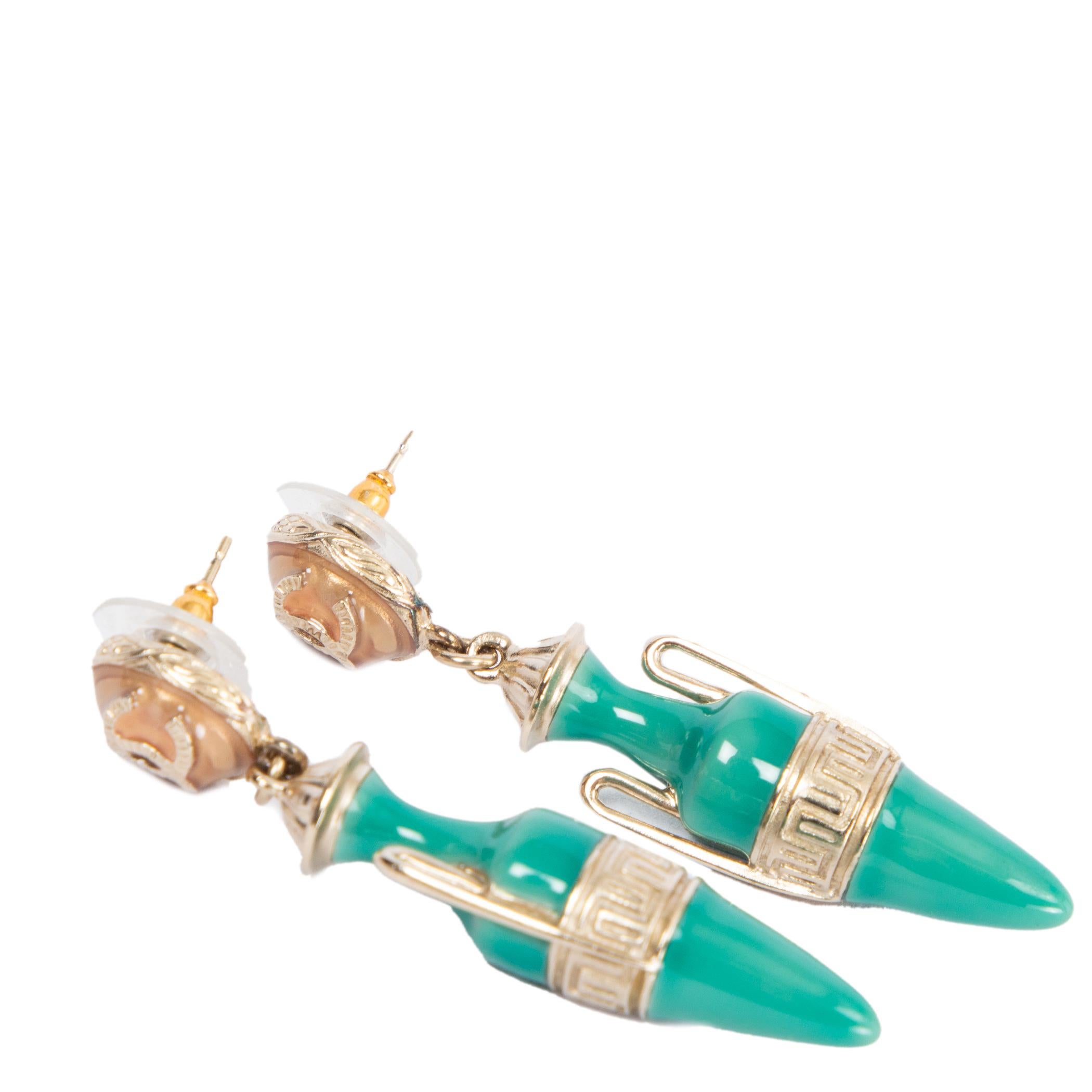 100% authentic Chanel 2018 CC drop earrings made from enamel and metal in turquoise green and light gold-tone hues, these drop earrings from Chanel boast an oversized pendant and are finished with the maison's signature interlocking CC logo for a