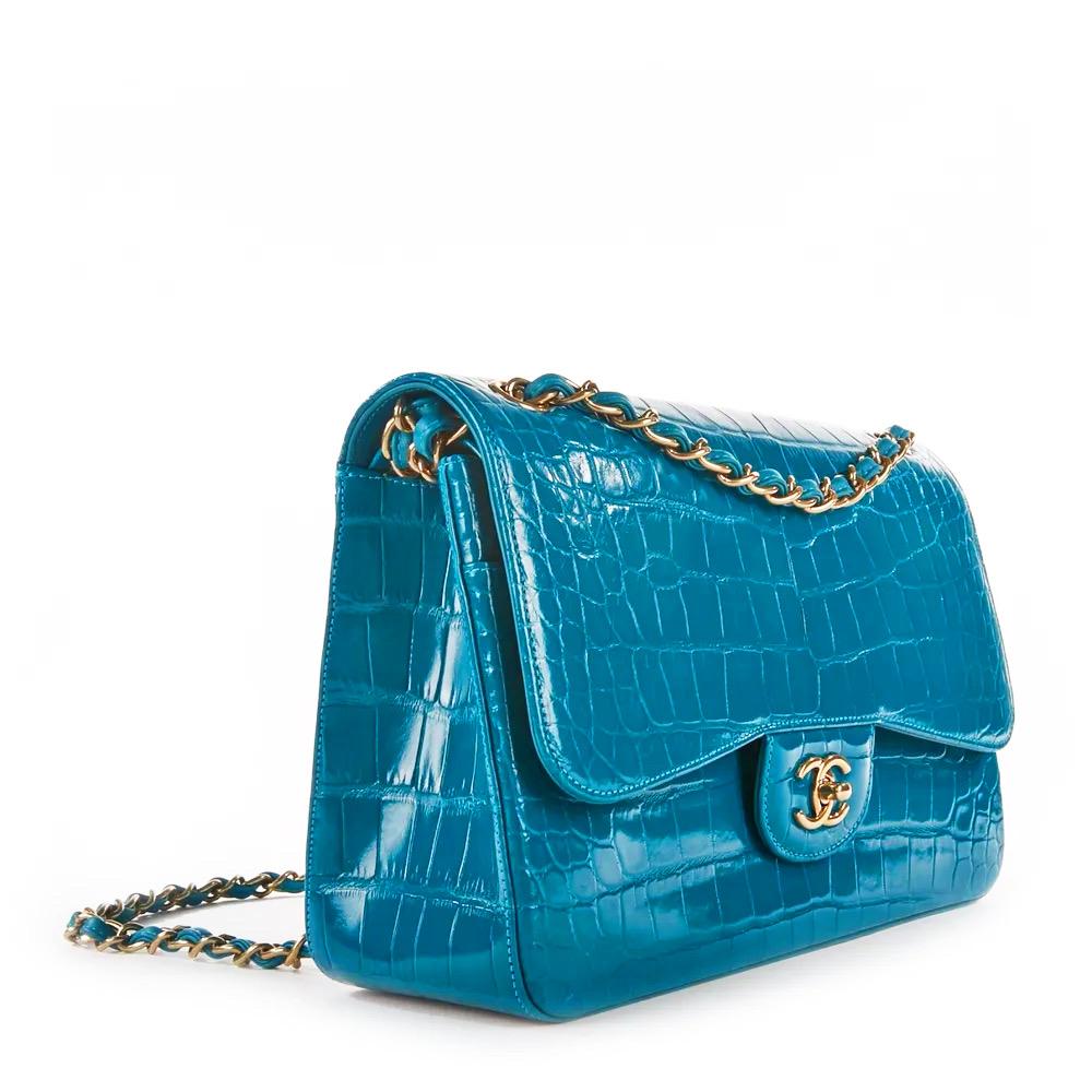 Rare Turquoise CHANEL Alligator Jumbo Double Flap Bag is a must for any collector of exotic handbags in general and Chanel bags in particular!  Features turquoise shiny alligator leather with silver-tone hardware, CC turn-lock closure, convertible
