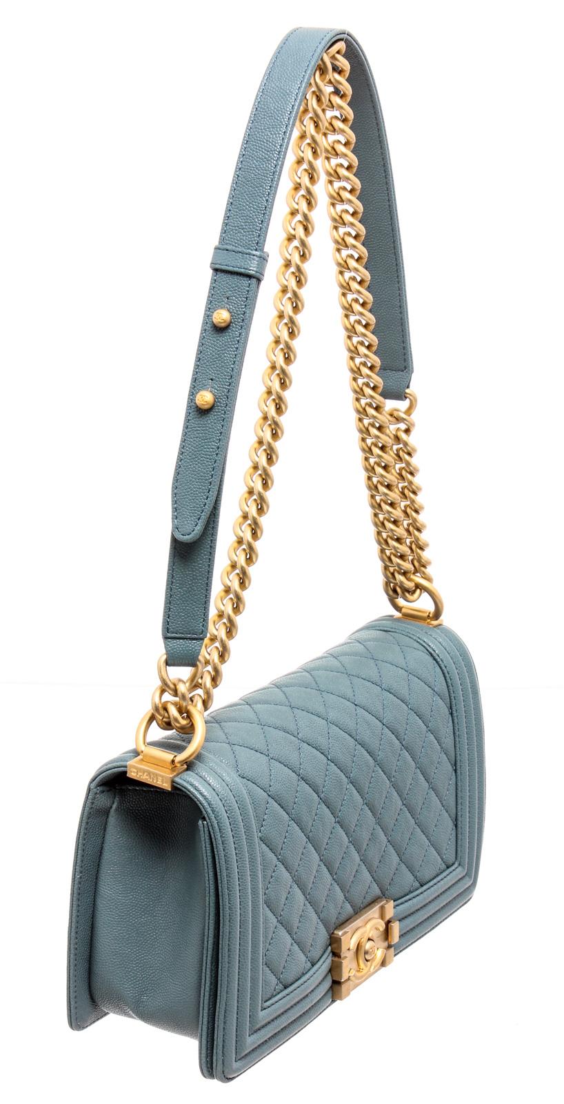 Chanel Turquoise Blue Caviar Leather Boy Bag with gold-tone hardware, convertible chain-link shoulder strap featuring leather shoulder guard, single slip pocket at interior and CC push-lock closure at front flap.

24758MSC
