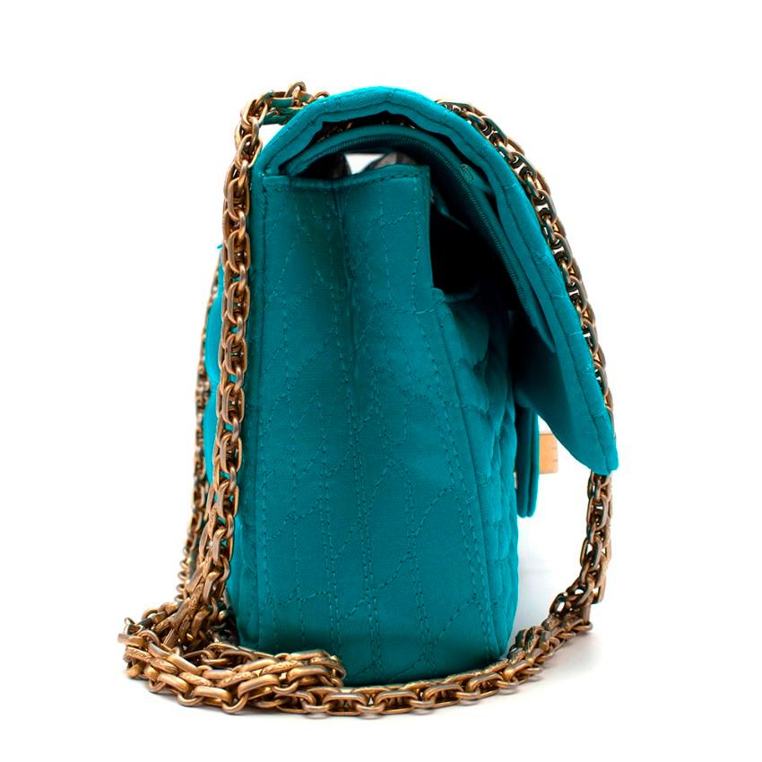 Chanel Turquoise Crocodile Embroidered Satin 2.55 Reissue 225 Flap

- Chanel signature Caviar silhouette 
- Bold teal colour-way 
- Double flap design 
- Cold Chanel embossed turn fastening 
- Mirrored panel on inner front flap 
- CC stitching on