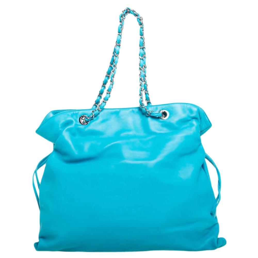 This gorgeous tote from Chanel will surely lift up your mood instantly. Crafted from leather, this is a luxe piece to add to your collection this season. The fabric used in its lining is of premium quality that adds to its durability. Created