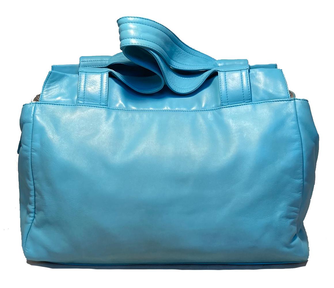 Chanel Turquoise Leather Discus Tote in very good condition. Beautiful soft turquoise lambskin leather exterior with fabulous leather discs upon front side in CC logo pattern. Double top shoulder straps or easy carrying. Top zipper closure opens to