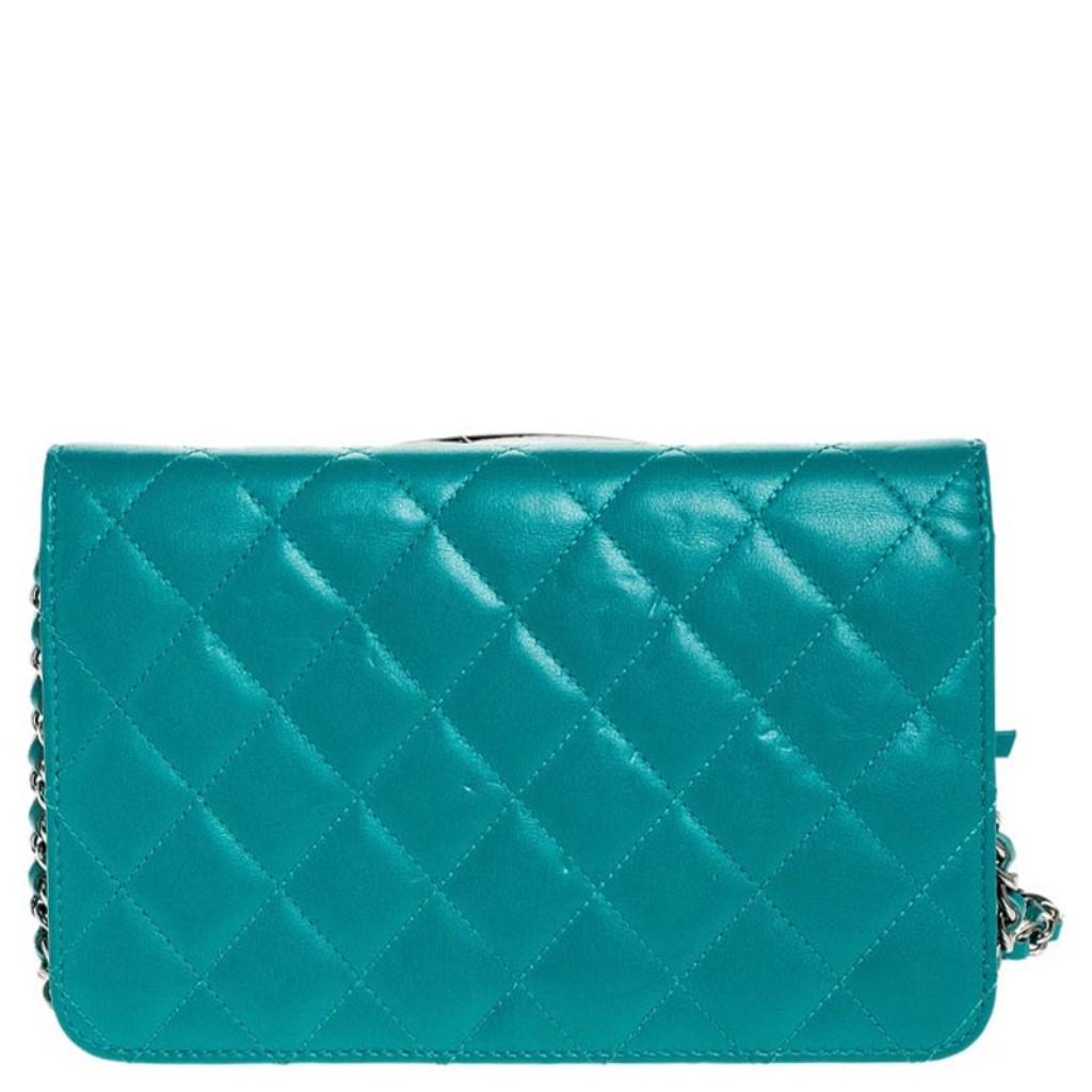 Chanel bags are coveted around the world for their sophistication and timeless design. This WOC flap bag is not different. Crafted from quality leather, this bag comes in a stunning shade of turquoise. It features the brand's iconic quilted pattern,