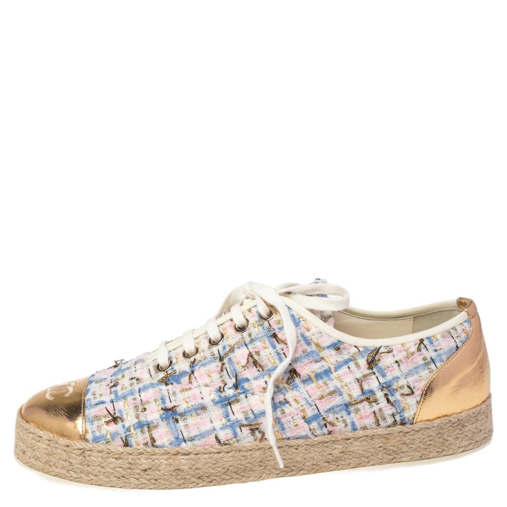 Step out in style with these chic espadrille sneakers from Chanel! These multicolored shoes feature a tweed & foil leather exterior with cap toes, CC logo, lace-ups, and durable rubber soles that offer a comfortable walk.

Includes: Original Dustbag