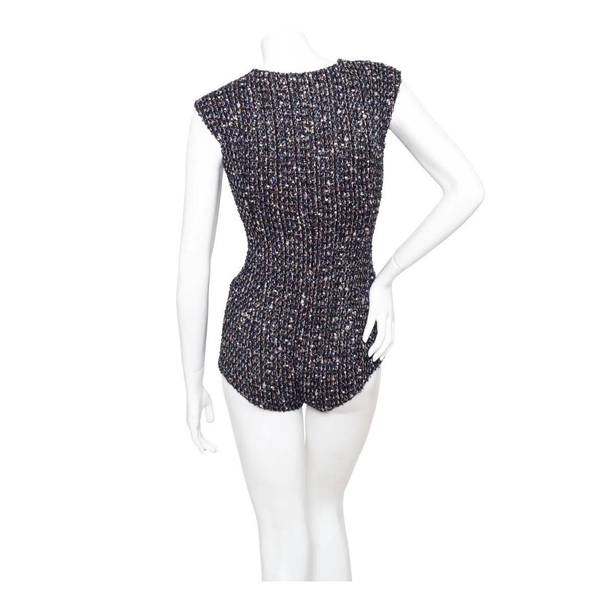 Tweed Fall '21–Winter '22 bodysuit by Chanel
Navy blue with metallic flecks and sequins
Round neckline
Front button closure
Front pockets
Gold-tone lion buttons
Cap sleeves
Made in France 
Fabric: 34% wool, 28% polyester, 21% polyamide, 7% acrylic,
