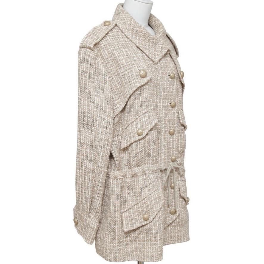 GUARANTEED AUTHENTIC CHANEL SPRING 2015 TWEED JACKET

Retailed excluding sales taxes $5,600

Details:
- Gorgeous full relaxed tweed jacket in rich tan and white colors.
- Concealed zipper closure and gold buttons down front.
- 4 patch pockets,