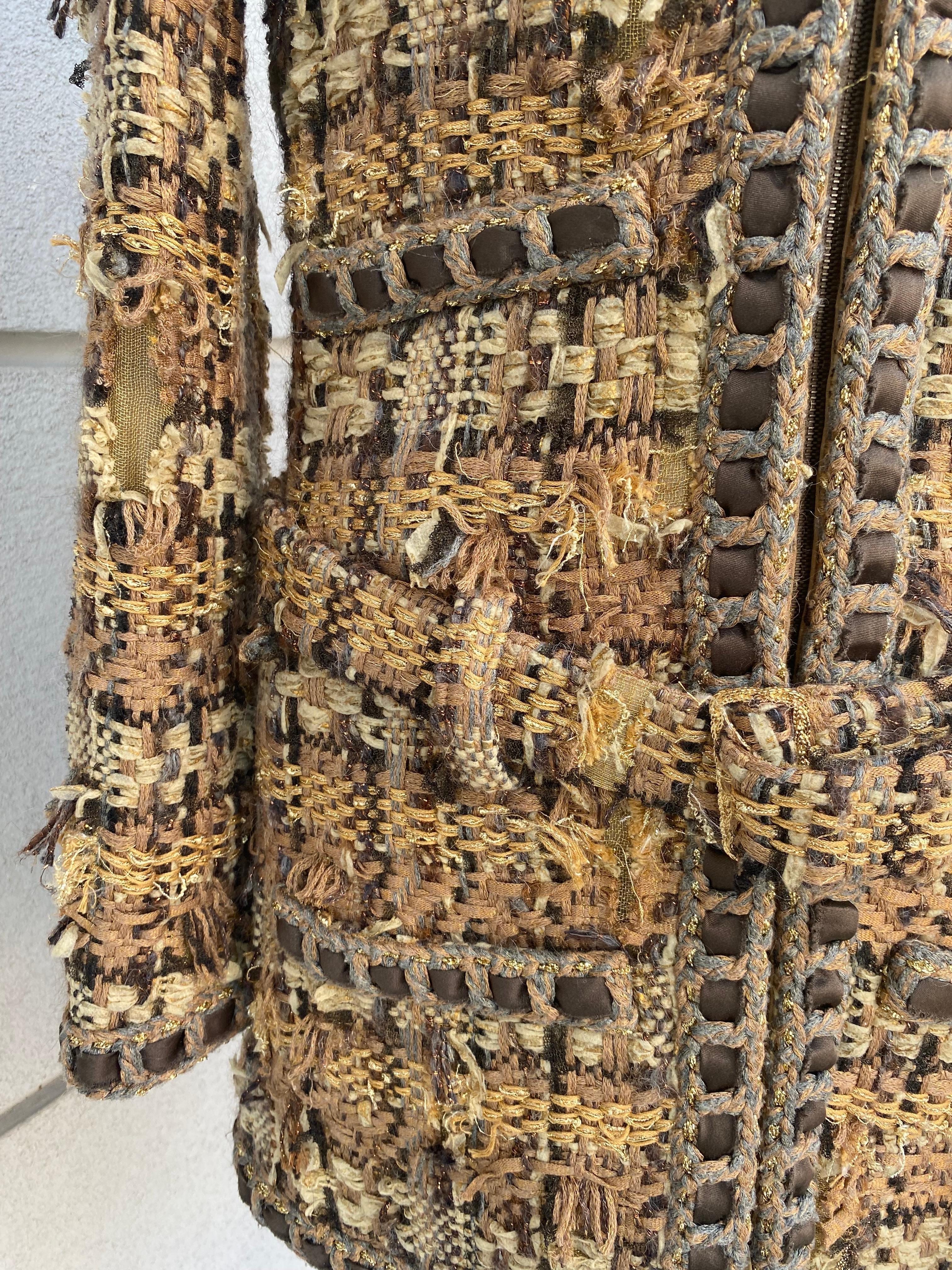 Chanel tweed Lesage coat from the Chanel pre fall 2016 fashion show. Size 36 French therefore 40 Italian, in mixed material, viscose and poly. The processing of the fabric is a ruined tweed effect wanted, front zip closure, there is a belt on the