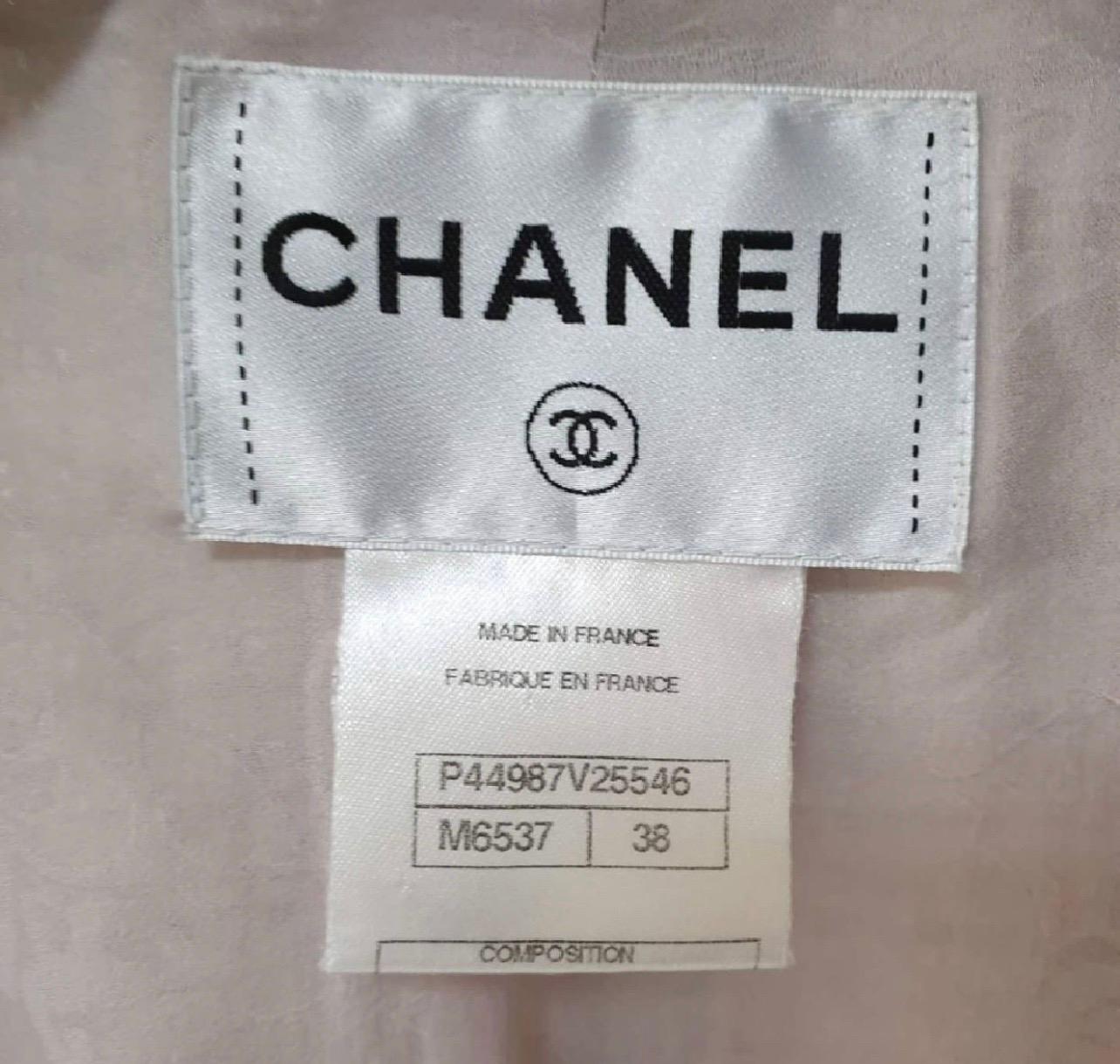 GUARANTEED AUTHENTIC CHANEL RUNWAY 13C VERSAILLES COLLECTION 
GORGEOUS FANTASY TWEED JACKET

Design:
- Iconic Chanel fantasy tweed jacket crafted with ricrac trim from the Runway 13C Versailles Collection.
- Notch lapels.
- Pastel colors.
- Dual
