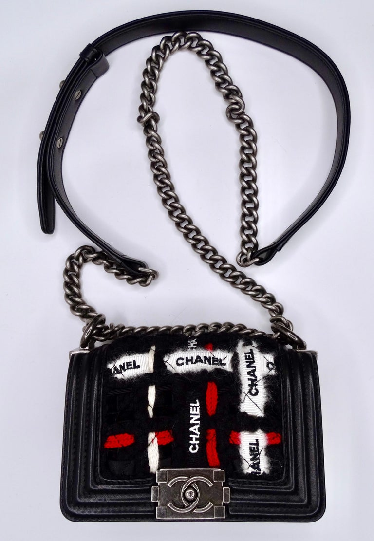 A mini Chanel Boy Bag but make it Rock & Roll! Mixing red and black leather will never fail to make you feel like your most confident self. The graphic print and deep textures of this Chanel will set it apart from the rest. Features include woven